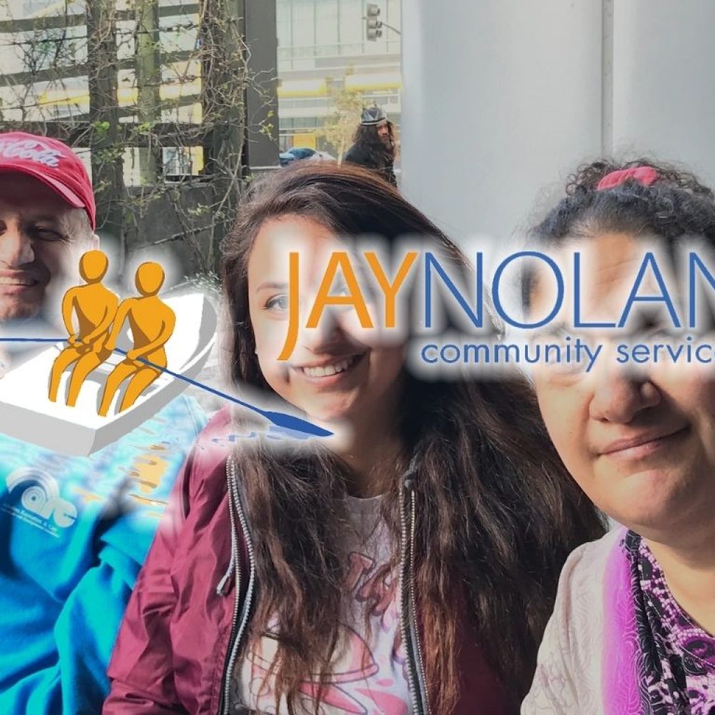 one man and two women sitting together and smiling at the camera with JNCS logo overlaid