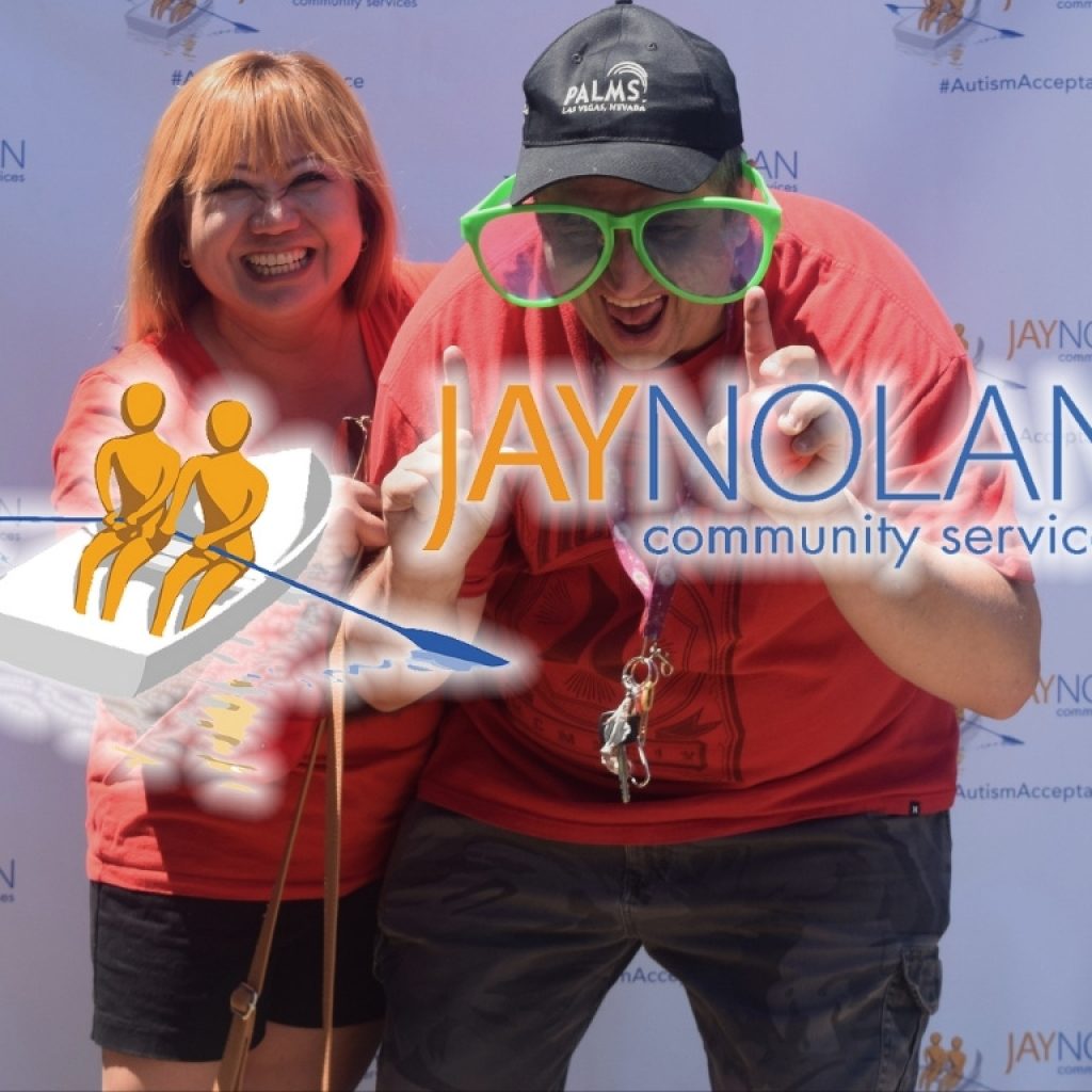 a man and women wearing red and smiling at the camera with JNCS logo overlaid