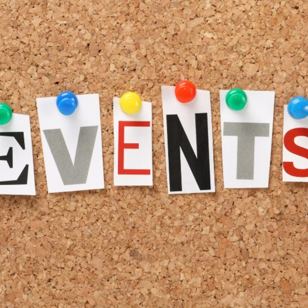 Cork bulletin board with pins holding up the word "EVENTS" in colorful capital letters.