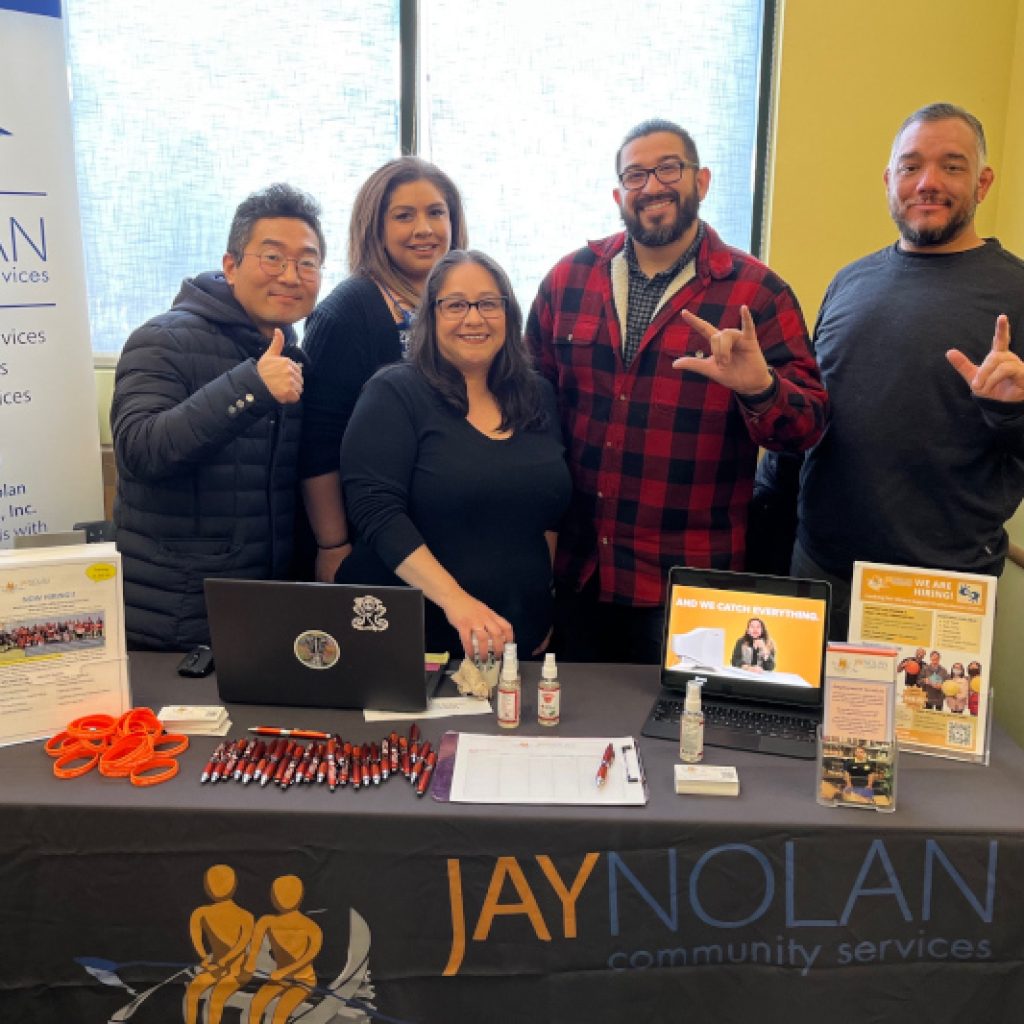 A group of Jay Nolan Community Services Employees at a job and resource fair.