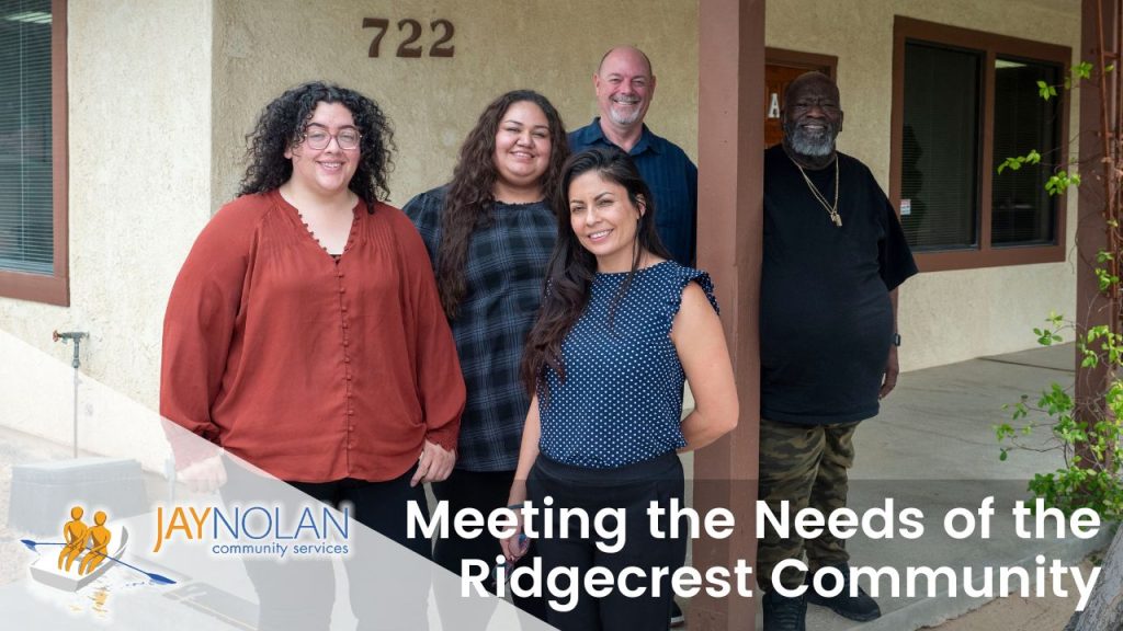 Video thumbnail with a group of Jay Nolan administrative and leadership staff posing in front of the Ridgecrest Jay Nolan office. Text reads: "Meeting the Needs of the Ridgecrest Community."