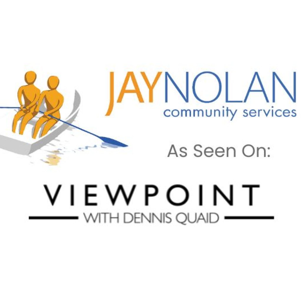 A logo image featuring the Jay Nolan Community Services emblem, which includes two figures rowing a boat. Below the emblem, the text reads "As Seen On: Viewpoint with Dennis Quaid," indicating a feature or appearance on the show.