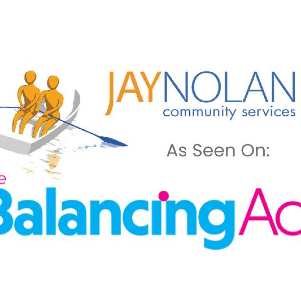 The logo for Jay Nolan Community Services, featuring two figures rowing a boat, accompanied by the text "As Seen On: The Balancing Act." The text "The Balancing Act" is in blue and pink, indicating a feature on the show.