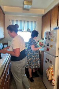 Marisol and Ilene cooking dinner