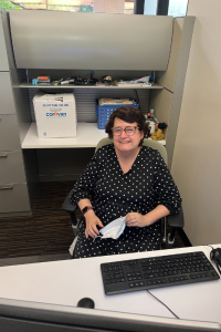 Ilene sitting at her desk