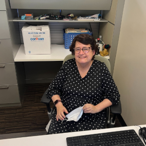 Ilene sitting at her desk