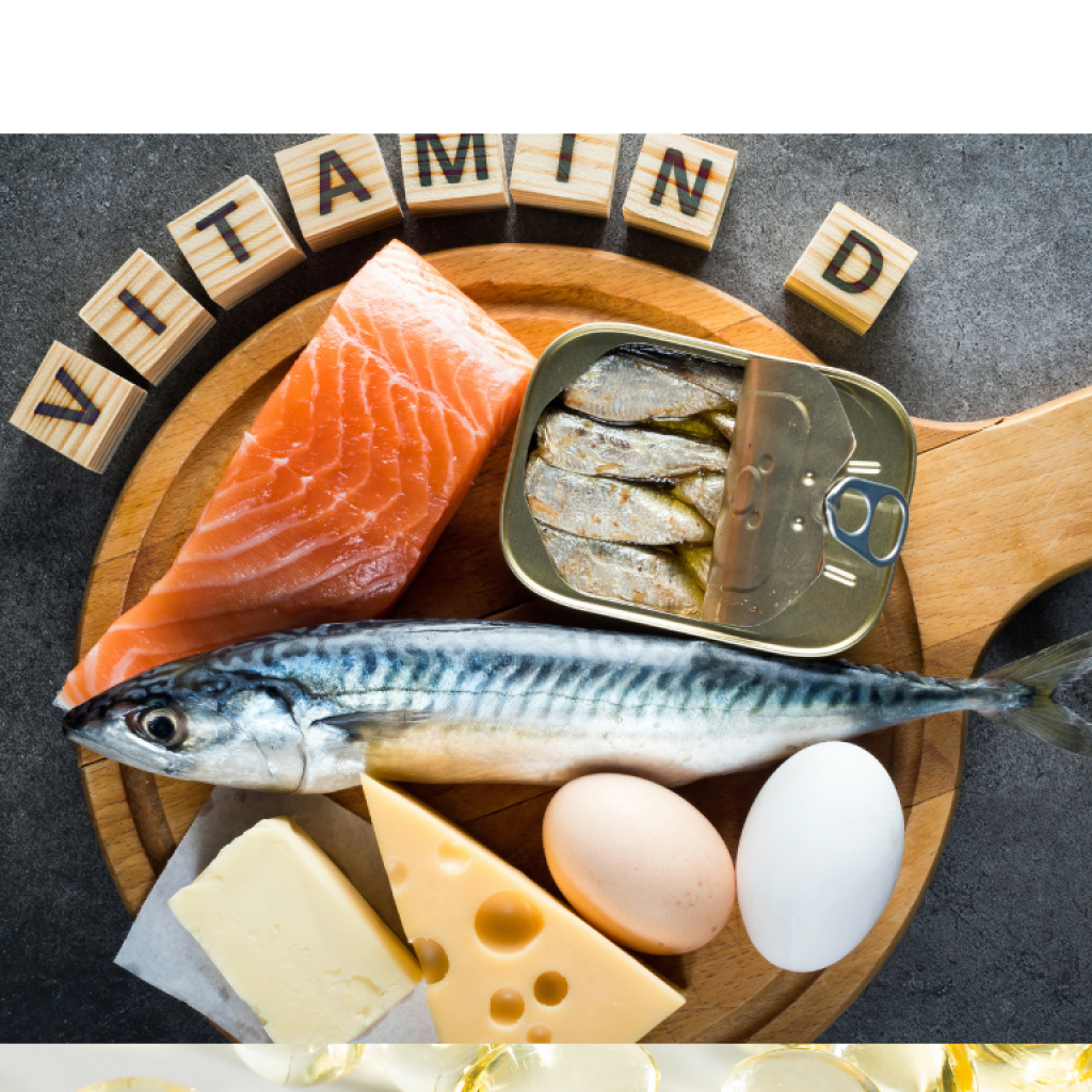 An array of vitamin D rich foods on a cutting board including fish, eggs, and cheese. Text reads "VITAMIN D"