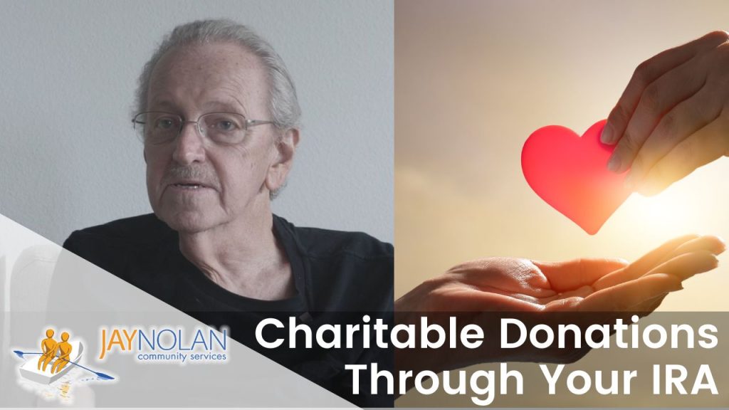 Video Thumbnail featuring an older Caucasian man with glasses wearing a black shirt and a hand placing a red heart onto the palm of another hand. Text reads: "Charitable Donations Through Your IRA"