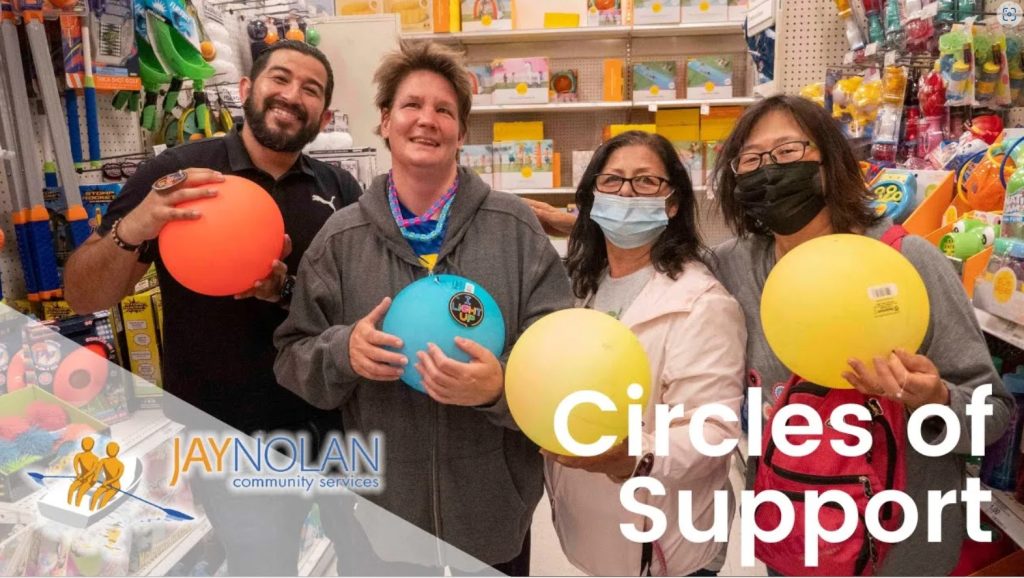 Video thumbnail featuring four people standing in a store holding colorful rubber balls. Text reads: "Circles of Support"