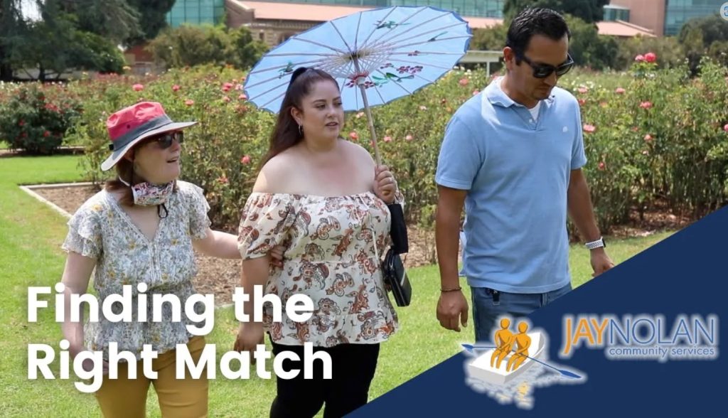 Video Thumbnail showing three people (two women wearing floral blouses and one man wearing a blue polo) walking through a rose garden. Text Reads: Finding the Right Match