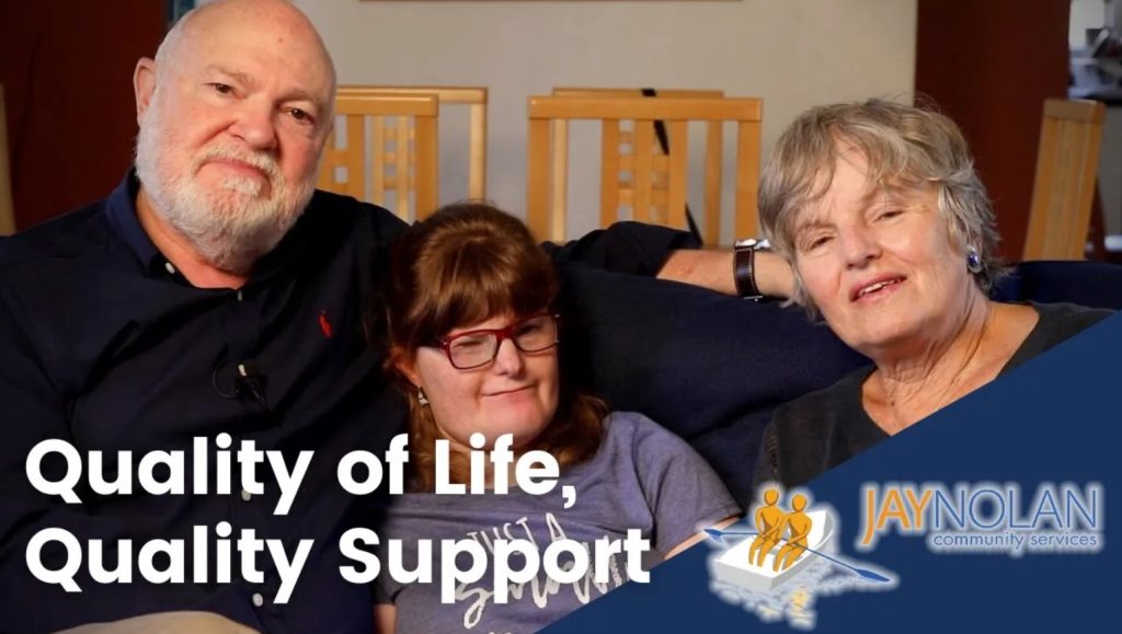 Video Thumbnail featuring a mom, dad, and daughter sitting on a couch in their home. Text reads: "Quality of Life, Quality Support"