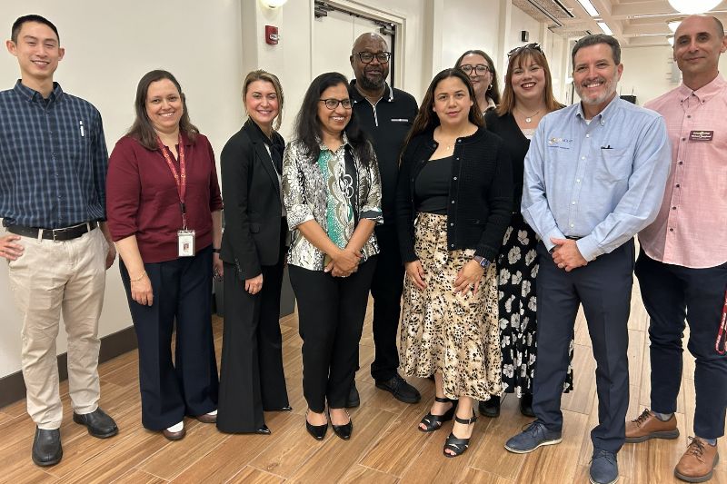 Group of administrative staff and Jay Nolan Staff posting together for a group photo