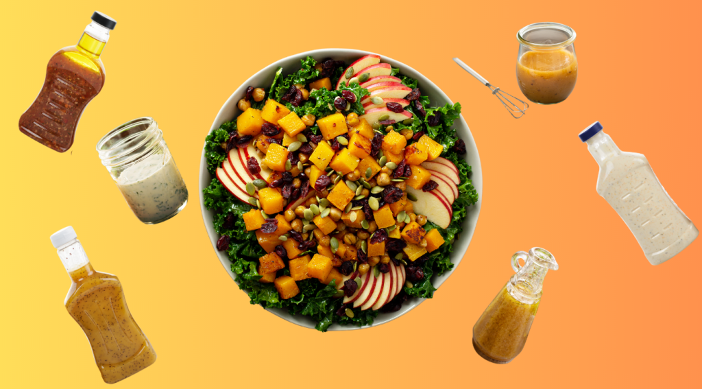 bowl of kale salad with squash, apple slices, cranberries and seeds surrounded by various salad dressings on orange background