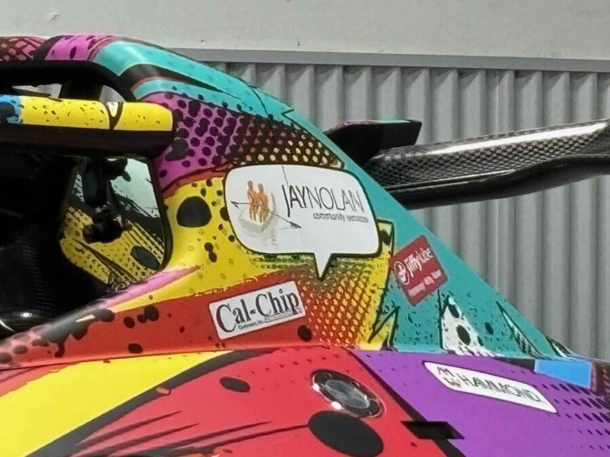 Close up of Racing with Autism's 2026 racecar with the Jay Nolan Community Services logo on it as a sponsor