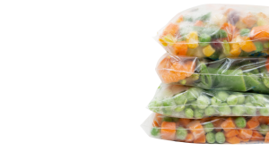 stacked bags of frozen food, such as vegetables 